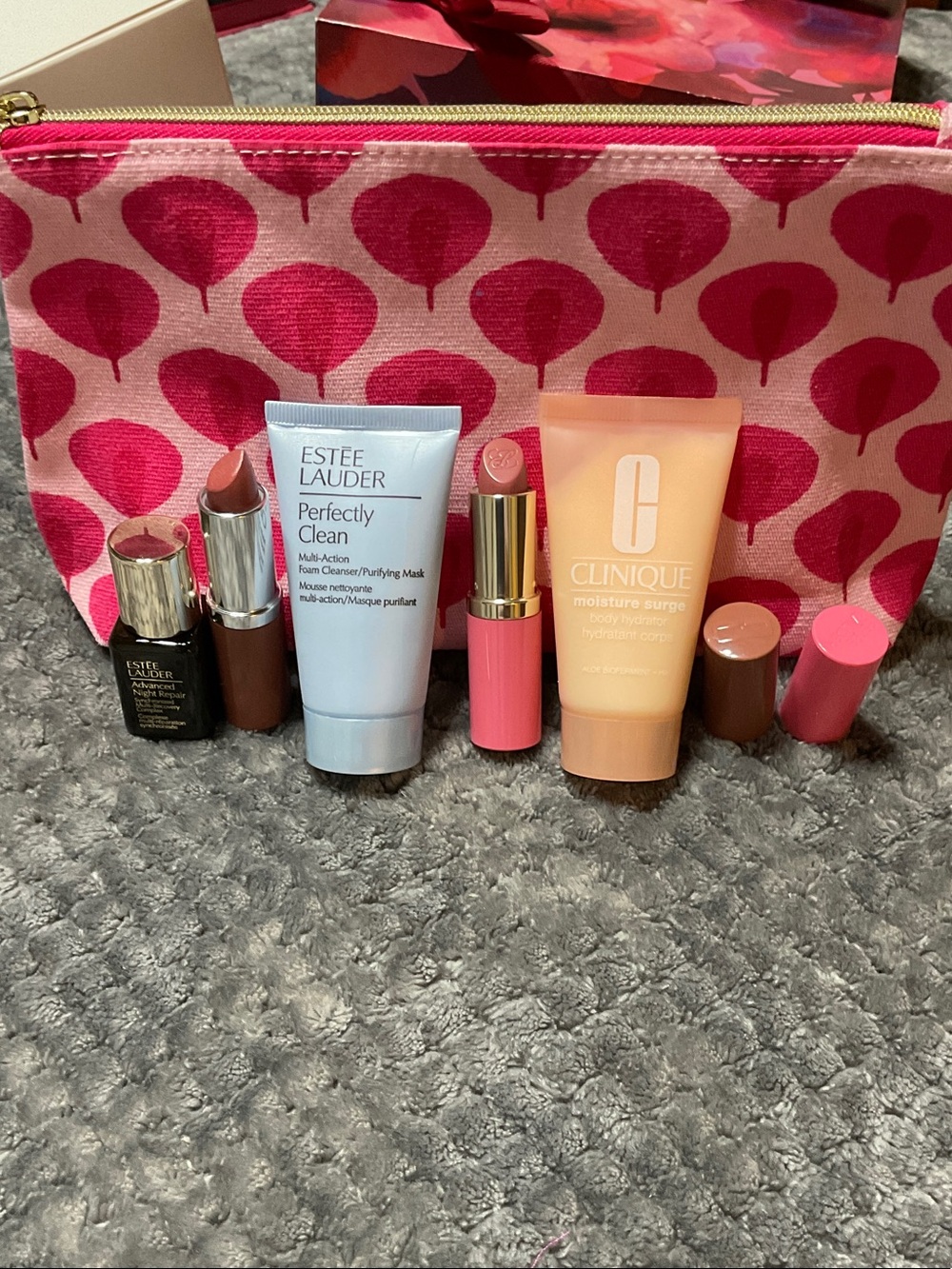 Estee Lauder items, Pink Patterned Pouch and Clinique items